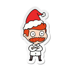 sticker cartoon of a man with mustache shocked wearing santa hat