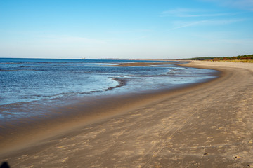Fototapeta na wymiar empty sandy beach by the sea