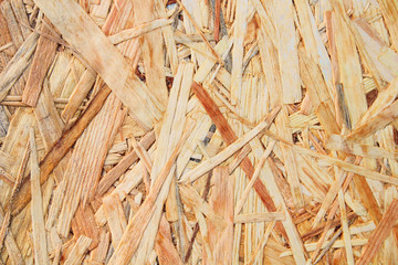 Oriented strand board. Wood sheet plywood. Close-up. Background. Texture.