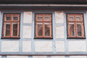 Fototapeta na wymiar three windows in a half-timbered house with reflection in Germany, Fachwerkhaus