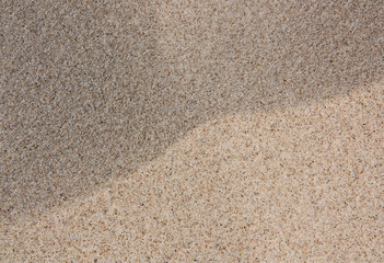 Fototapeta na wymiar the texture of the sand shot close-up