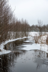frozen bodies of water in deep winter under snow