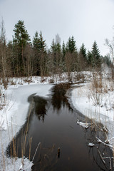 frozen bodies of water in deep winter under snow