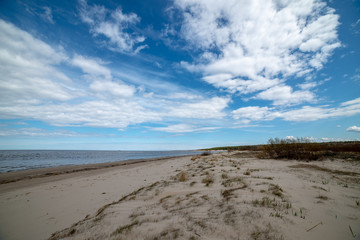 Fototapeta na wymiar empty sandy beach by the sea