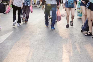 Rolgordijnen the pedestrian,many legs of people,people in a shopping street © CStock