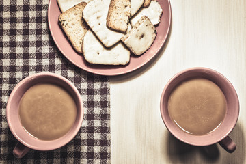 Cookies and coffee for two in vintage style