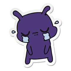 sticker cartoon of cute sad alien