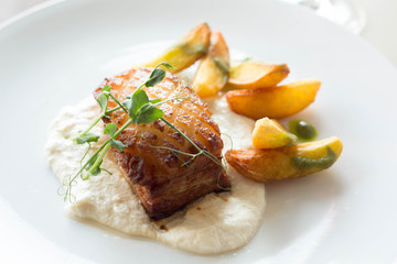 grilled pork steak with sauce and vegetables