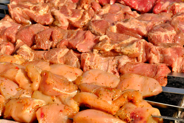 Meat on a skewer is grilled