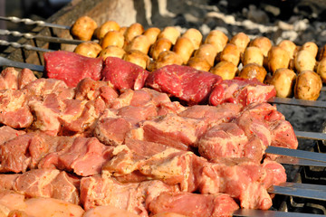 Grilled potatoes and meat