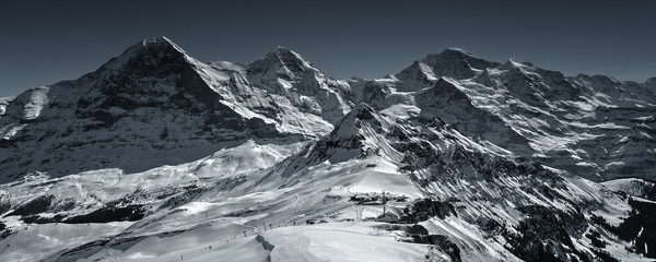 Spectacular winter scenery in the Swiss Alps with famous Eiger, Moench & Jungfrau, Bernese Oberland, Switzerland - obrazy, fototapety, plakaty
