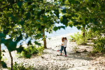 Young happy couple on seashore