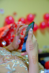 Young bride girl holding her mobile