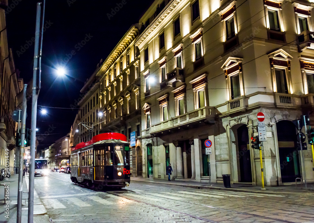 Wall mural tram on the night street in milan