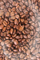 close up texture patern brown coffee beans with smoke isolated on white