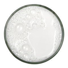 Glass of milk with bubbles isolated on white background, top view, clipping path 