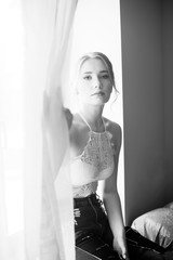 Young and beautiful model woman with professional makeup and hair posing. Bride's morning.