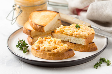 Chicken pate with carrots on toast bread, delicious spread for Breakfast. Healthy food, vegetable snack, wine aperitizer