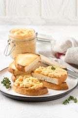Chicken pate with carrots on toast bread, delicious spread for Breakfast. Healthy food, vegetable snack, wine aperitizer