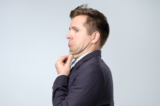 Young Man In Suit With A Double Chin.