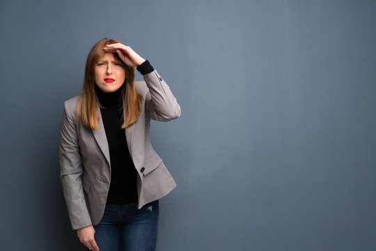 Redhead Business Woman Looking Far Away With Hand To Look Something