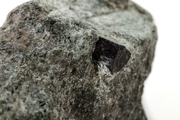 macro mineral stone schorl, black tourmaline on white background