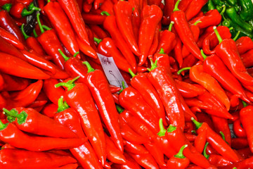 Red chili pepper background made of vegetables.
