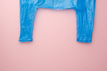 Market blue cellophane. No polyethylene. Top view. pink background