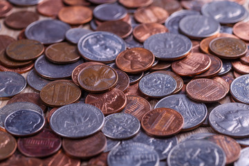 Pile of Golden coin, silver coin, copper coin, quarters, nickels, dimes, pennies, fifty cent piece and dollar coins. Various USA coins, American coins for business, money, financial coins and economy