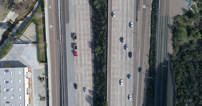 An overhead view of traffic driving on the highway during the afternoon in California.