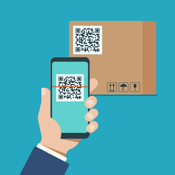 Hand With A Modern Smartphone Scans Qr Code On A Cardboard Box