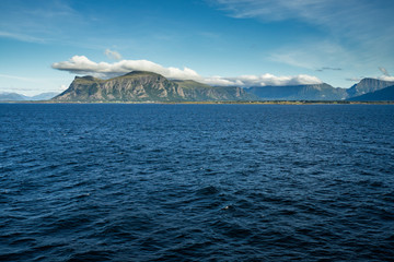 Fototapeta na wymiar Western Norway coastline and landscape viewed form Hurtrigruten cruise ship