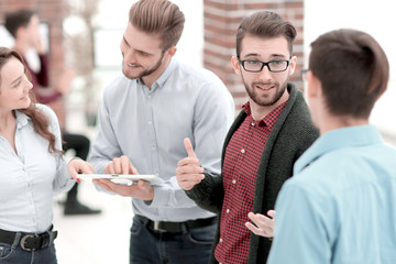 Business team with tablet pc computer having discussion in offic