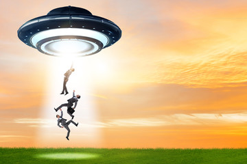 Flying saucer abducting young businessman 