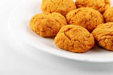 Classic homemade carrot cookies with peanut butter on a white background