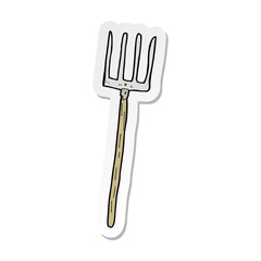 sticker of a cartoon pitch fork