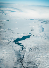 Obraz premium Aerial view of Iceland. Aerial view of amazing iceland landscapes, glacier patterns, mountains, rivers and shapes. Beautiful natural backdrop. Iceland from sky.