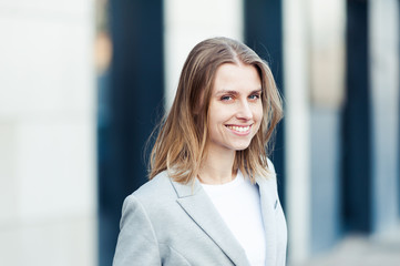 Blonde young smiling businesswoman