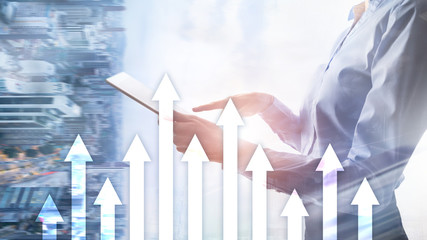 Up arrow graph on skyscraper background. Invesment and financial growth concept.