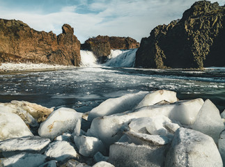 Famous Hjalparfoss double waterfall in southern Iceland with sky and clouds. treking in Iceland....