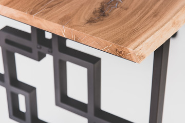 Loft style table: oak cover, metal base in matte black color, angle view. Custom furniture...