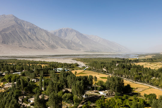 Fertile Wakhan Valley near Vrang in Tajikistan. The mountains in the background are the Hindu Kush in Afghanistan