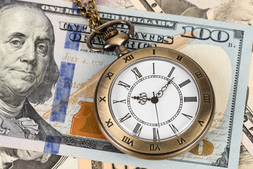 Fototapeta na wymiar Vintage pocket watch clock on dollar banknote concept for money time value