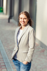 Portrait of beautiful smiling blonde young woman 