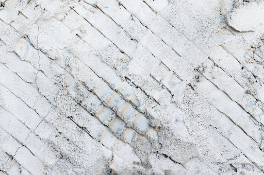 Background, metal mesh covered and smeared with concrete.