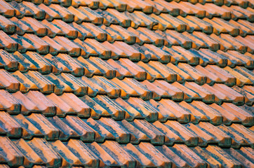 Old Red Ceramic Roof Tiles Background. Old pitched roof