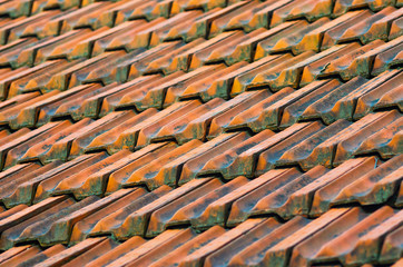 Old Red Ceramic Roof Tiles Background. Old pitched roof