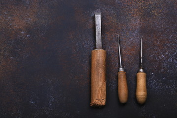 old retro repair tools on rusty background