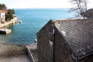 Fototapeta na wymiar Old fishing house on the Adriatic Sea coast in lagoon.