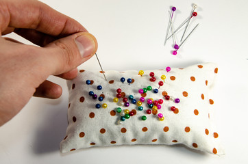 Needle invisible with colored ends in their hands